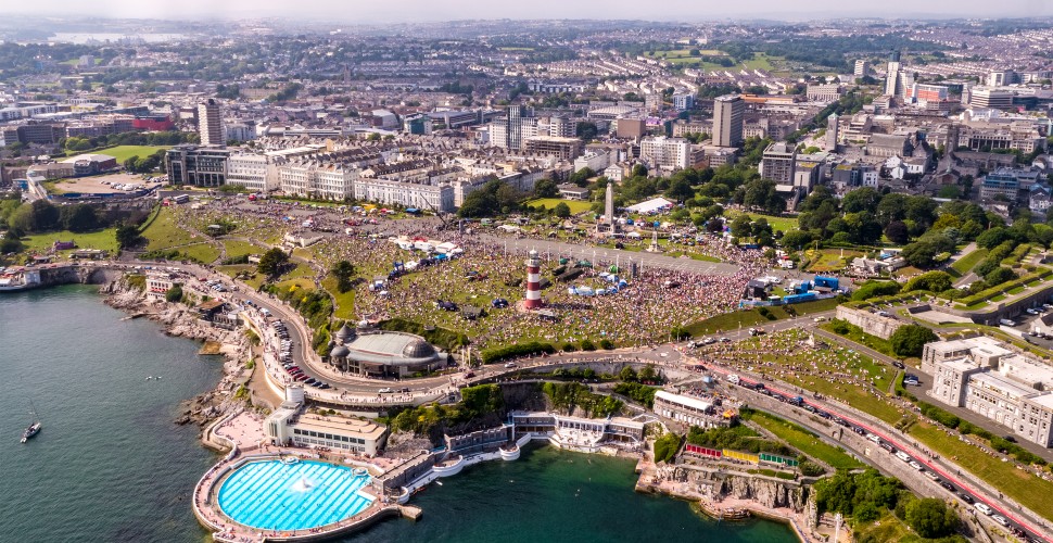 Drone image overlooking Plymouth Hoe during Armed Forces Day with thousands of people attending